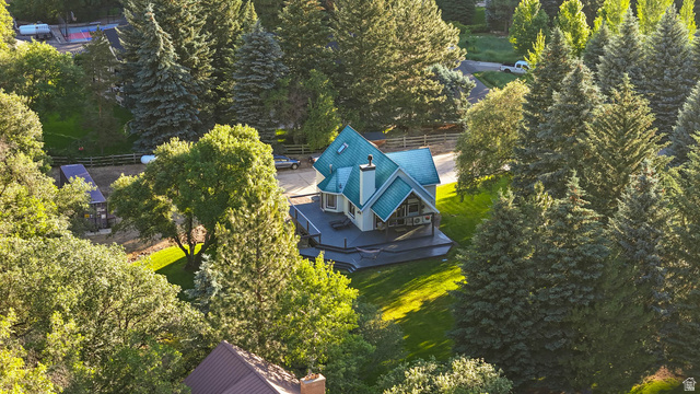 10686 South Covered Brg Cyn Road, Unit 14 Spanish Fork, UT 84660 - Photo 20 of 44 Mountain-style residence featuring a distinctive blue metal roof, multiple exterior gables, and a prominent chimney