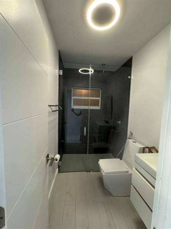 641 Southwest 35th Avenue Miami, FL 33135 - Photo 16 of 25 a bathroom with a tub a toilet and a shower