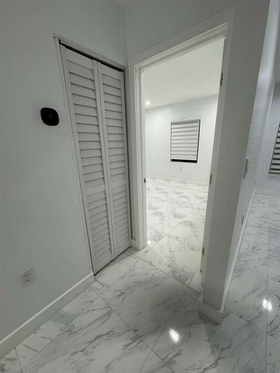 641 Southwest 35th Avenue Miami, FL 33135 - Photo 17 of 25 an empty room with a workbench