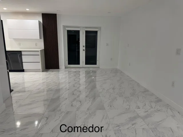 a large bathroom with a large tub and sink