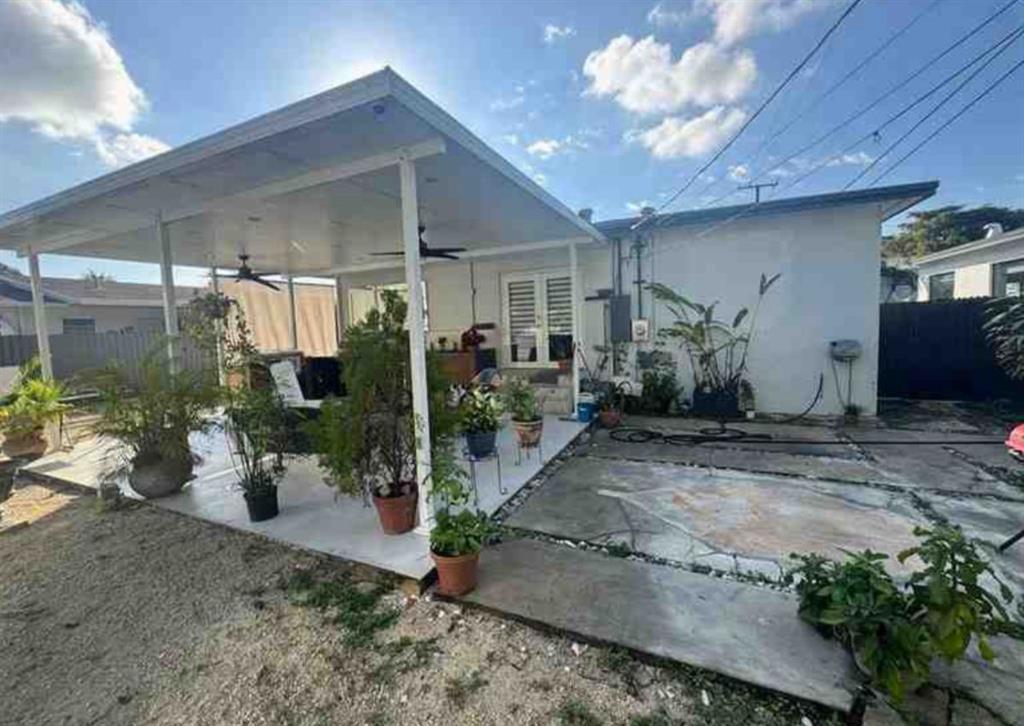 641 Southwest 35th Avenue Miami, FL 33135 - Photo 22 of 25 a view of a porch with potted plants