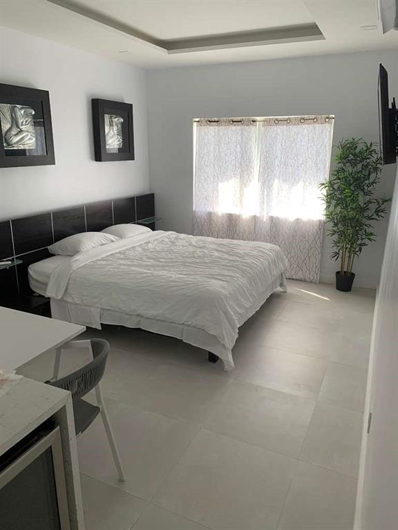 641 Southwest 35th Avenue Miami, FL 33135 - Photo 25 of 25 a bedroom with a bed and a window