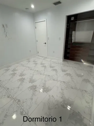a view of kitchen with refrigerator sink and oven