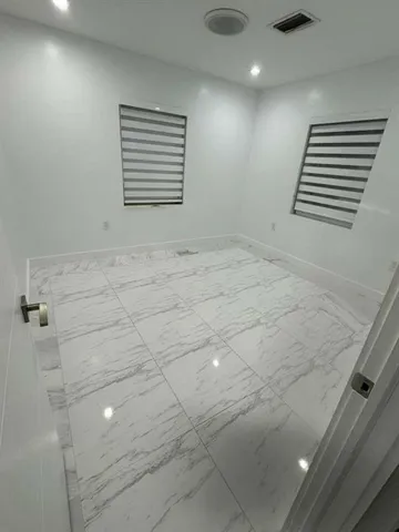 a kitchen with stainless steel appliances a refrigerator and a sink