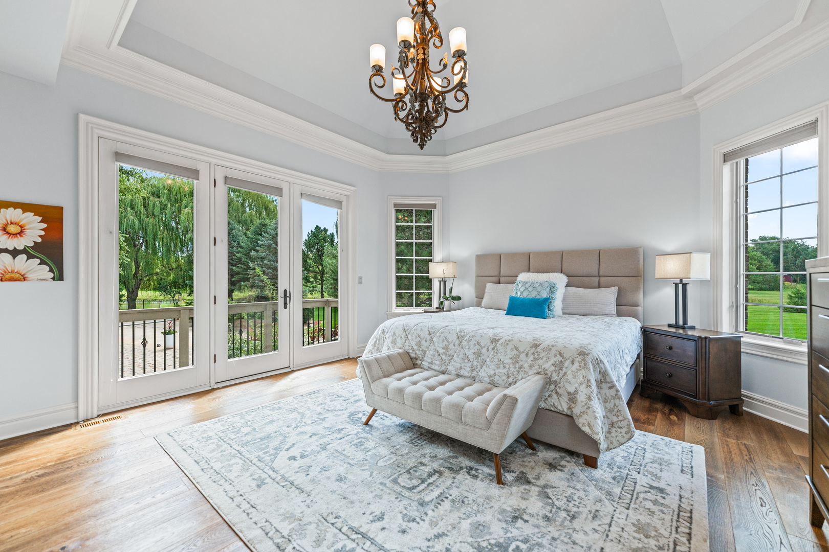 5N155 Prairie Rose Drive St. Charles, IL 60175 - Photo 47 of 148 a bedroom with a large bed and a chandelier