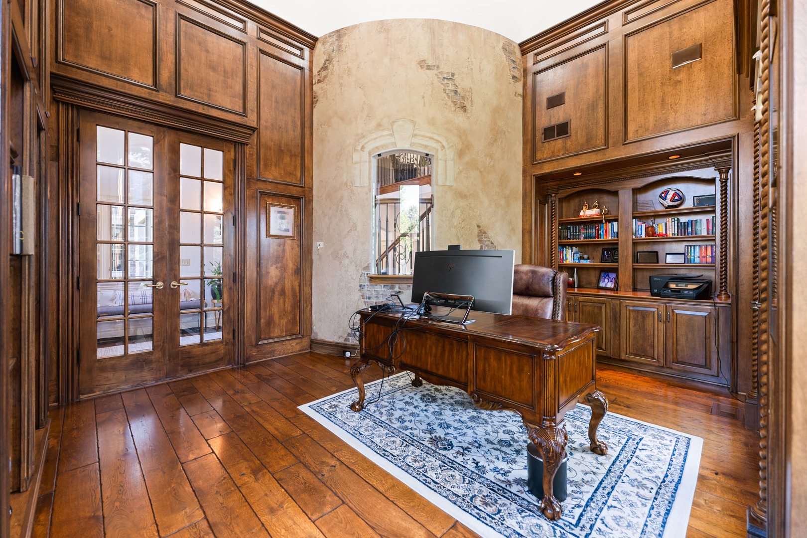 5N155 Prairie Rose Drive St. Charles, IL 60175 - Photo 6 of 148 a view of a workspace with furniture and a book shelf