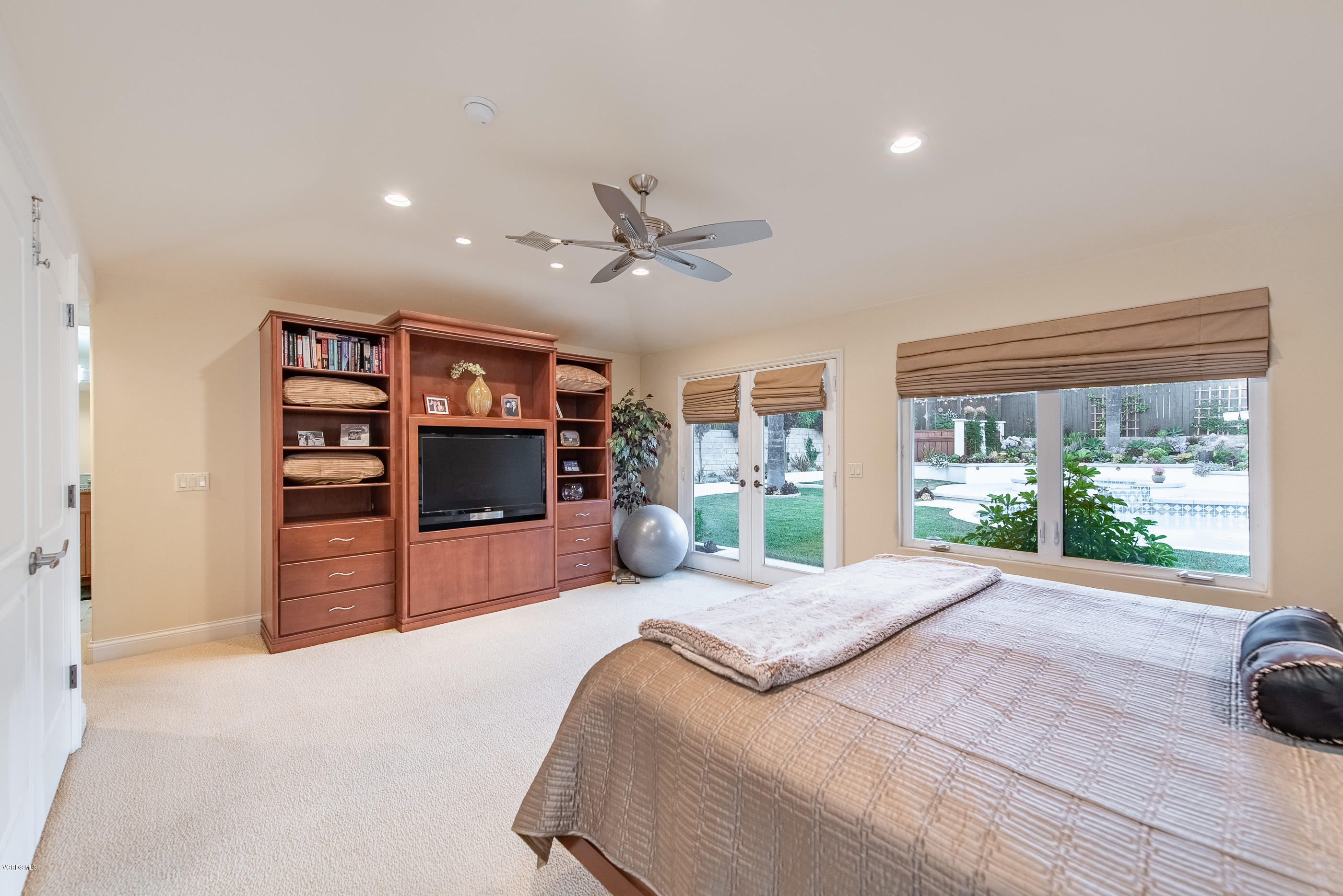 1628 Riente Street Camarillo, CA 93010 - Photo 22 of 91 a large bedroom with a bed and a large window with the outer view