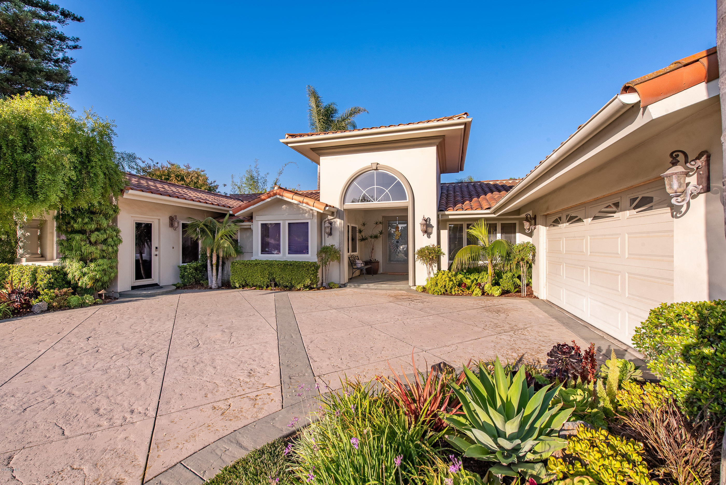 1628 Riente Street Camarillo, CA 93010 - Photo 4 of 91 a front view of a house with a yard