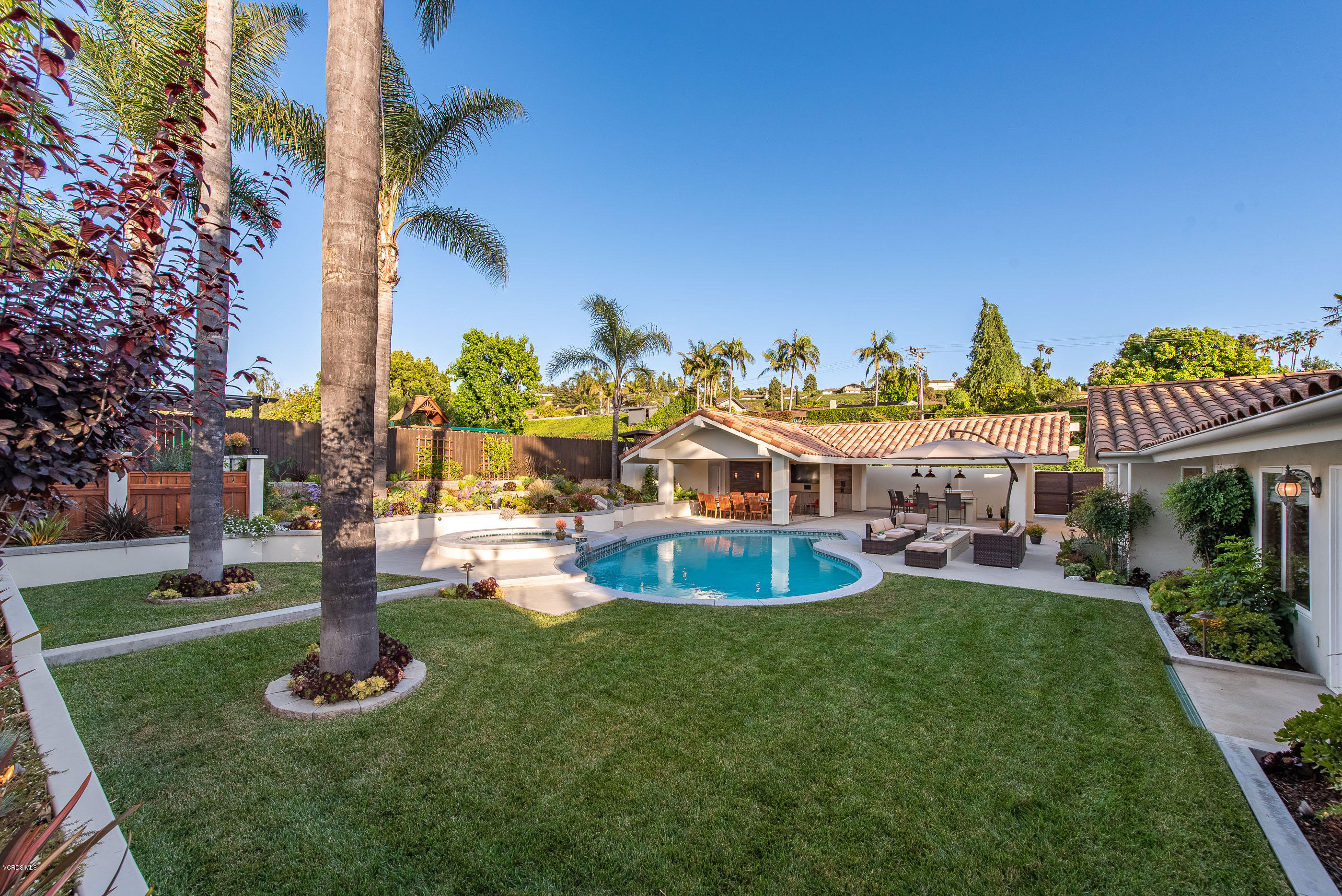 1628 Riente Street Camarillo, CA 93010 - Photo 40 of 91 a swimming pool with outdoor seating and yard