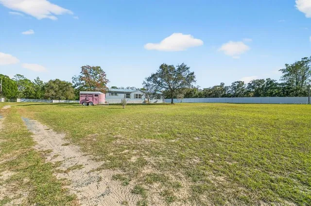a view of a swimming pool and an outdoor seating
