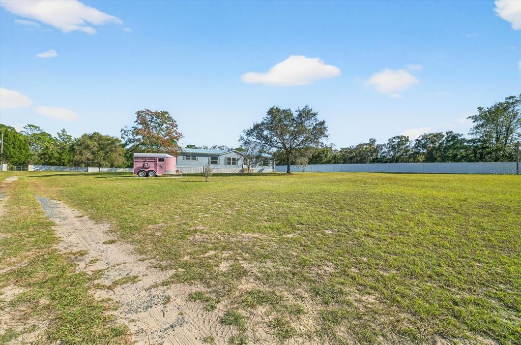 5280 Golddust Road Spring Hill, FL 34609 - Photo 34 of 41 a view of a swimming pool and an outdoor seating