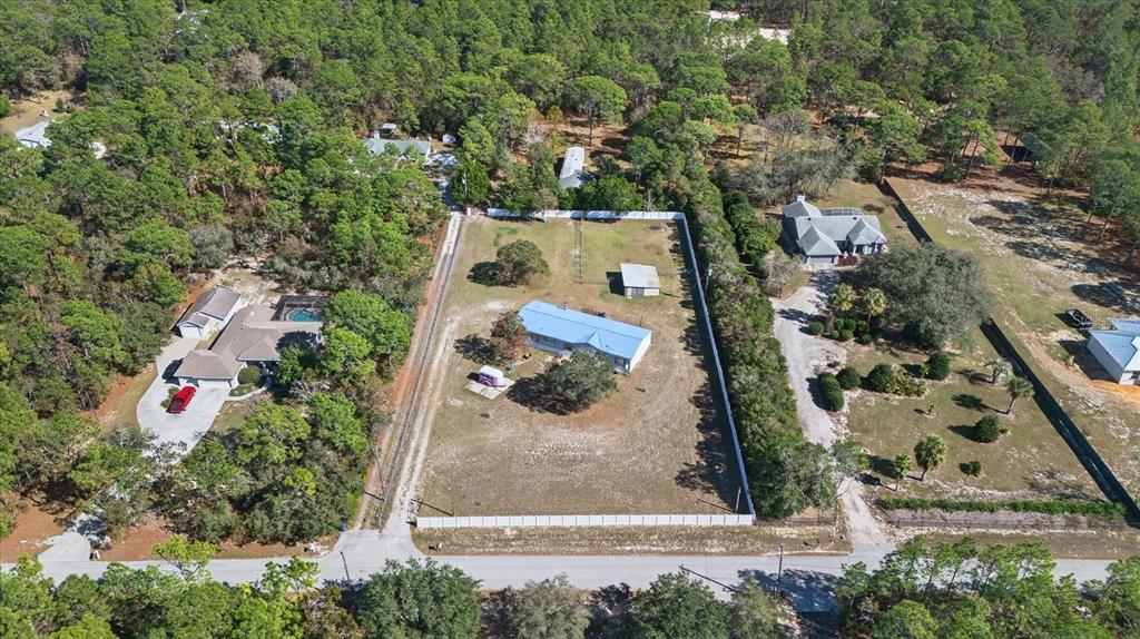 5280 Golddust Road Spring Hill, FL 34609 - Photo 4 of 41 an aerial view of residential house with outdoor space and parking