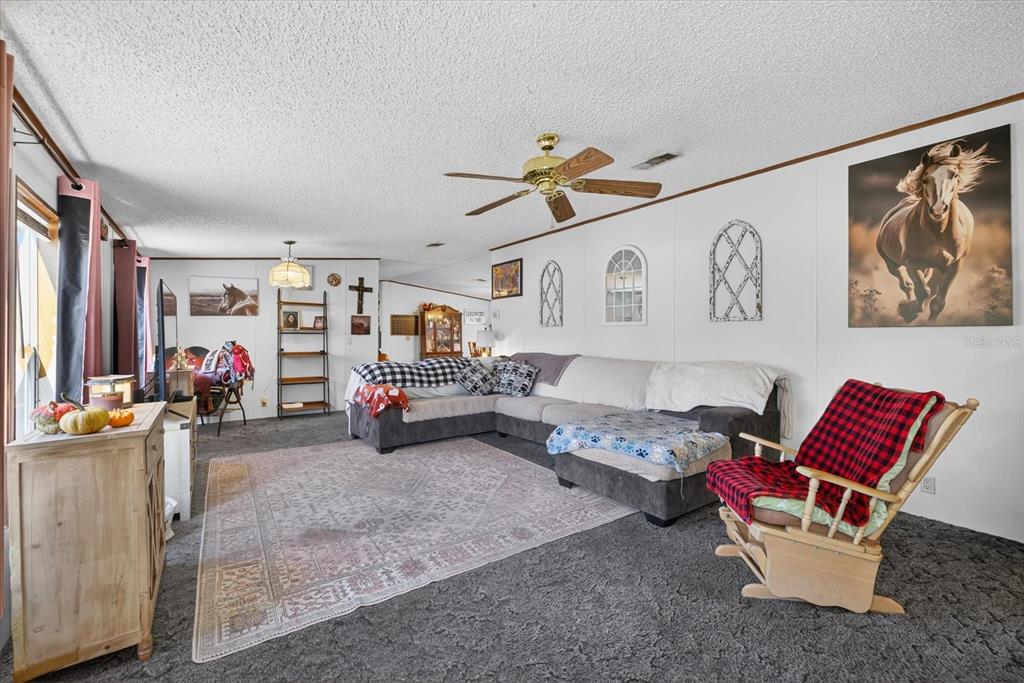 5280 Golddust Road Spring Hill, FL 34609 - Photo 5 of 41 a living room with furniture and a couch