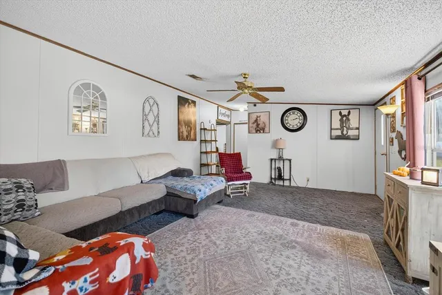a living room with furniture and a clock