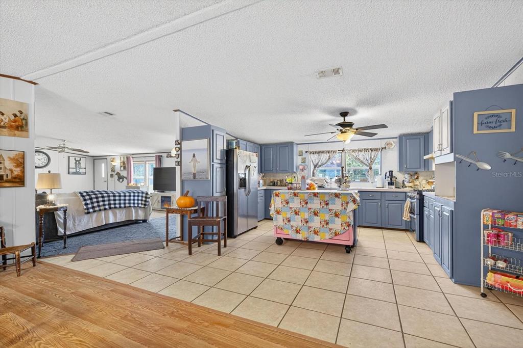 5280 Golddust Road Spring Hill, FL 34609 - Photo 10 of 41 a bedroom with furniture and a chandelier