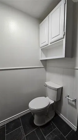a bathroom with a toilet