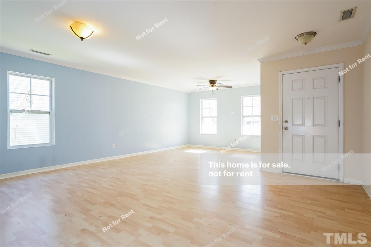 4439 Stonewall Drive Raleigh, NC 27604 - Photo 11 of 27 wooden floor in an empty room with a window