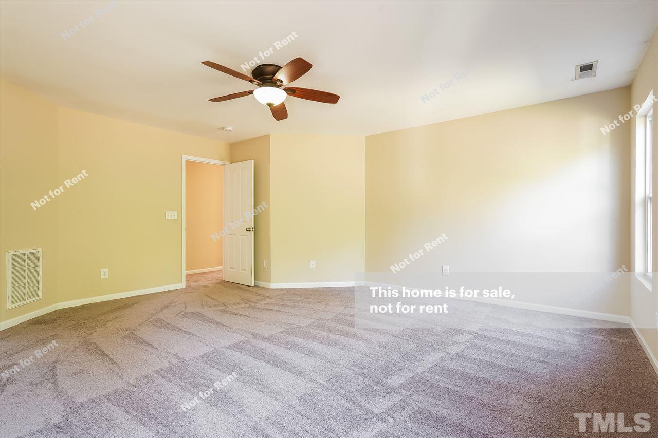 4439 Stonewall Drive Raleigh, NC 27604 - Photo 17 of 27 a view of a room with wooden floor