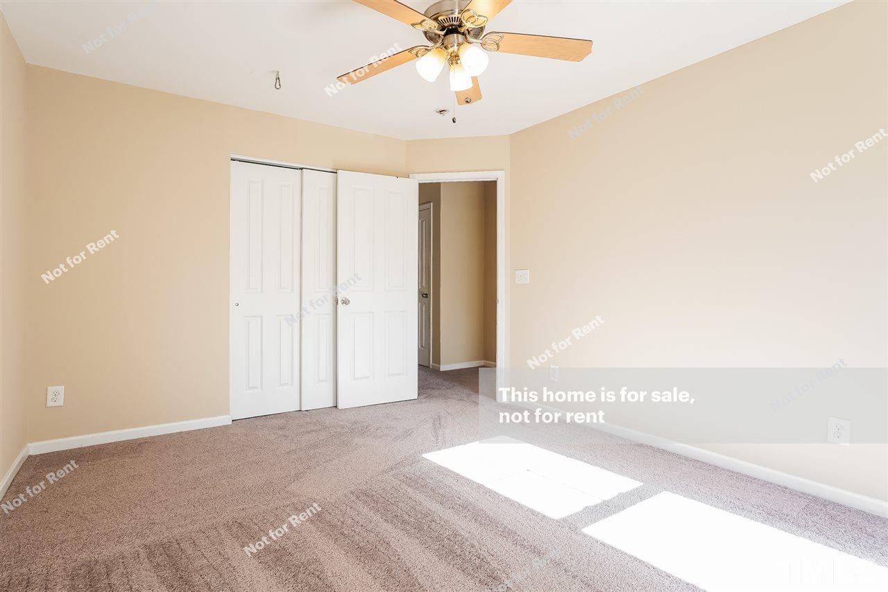 4439 Stonewall Drive Raleigh, NC 27604 - Photo 19 of 27 a view of a livingroom with a ceiling fan and window