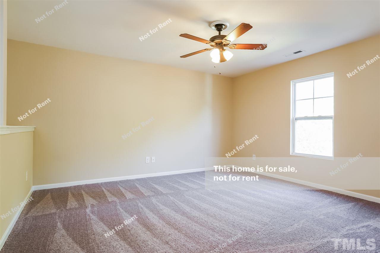 4439 Stonewall Drive Raleigh, NC 27604 - Photo 22 of 27 wooden floor in an empty room with a window