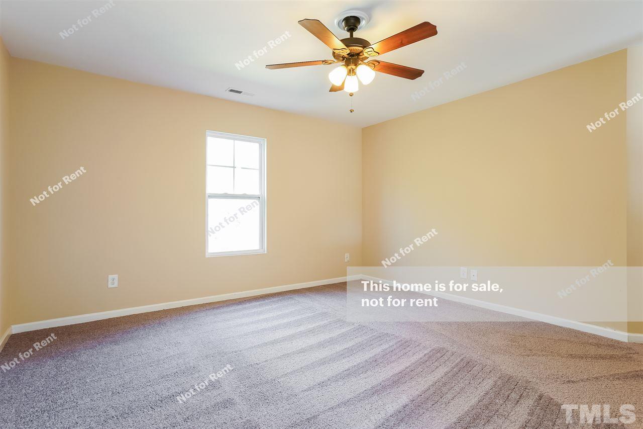 4439 Stonewall Drive Raleigh, NC 27604 - Photo 23 of 27 a view of an empty room with a window