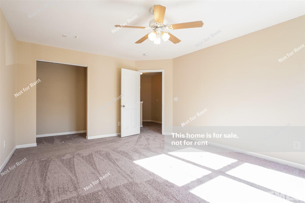 4439 Stonewall Drive Raleigh, NC 27604 - Photo 24 of 27 a view of a livingroom with a chandelier fan