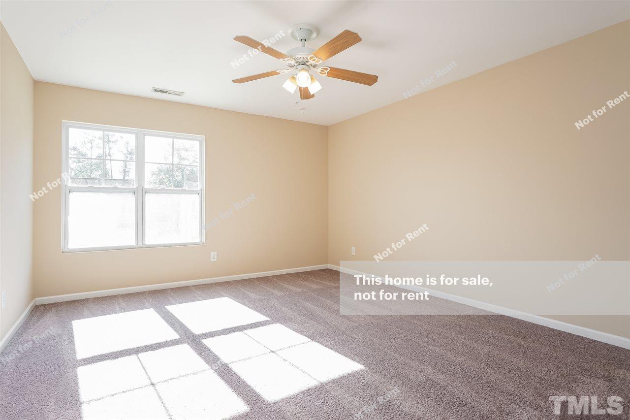 4439 Stonewall Drive Raleigh, NC 27604 - Photo 25 of 27 a view of an empty room and window