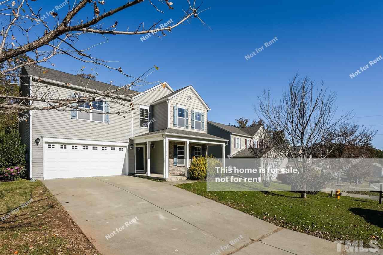 4439 Stonewall Drive Raleigh, NC 27604 - Photo 8 of 27 a front view of a building with a garden
