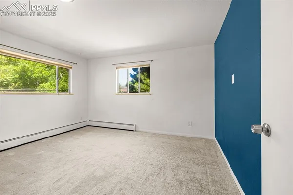 an empty room with windows