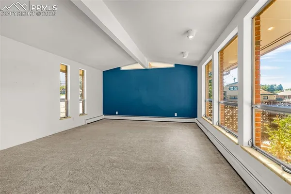 a view of an empty room with a window