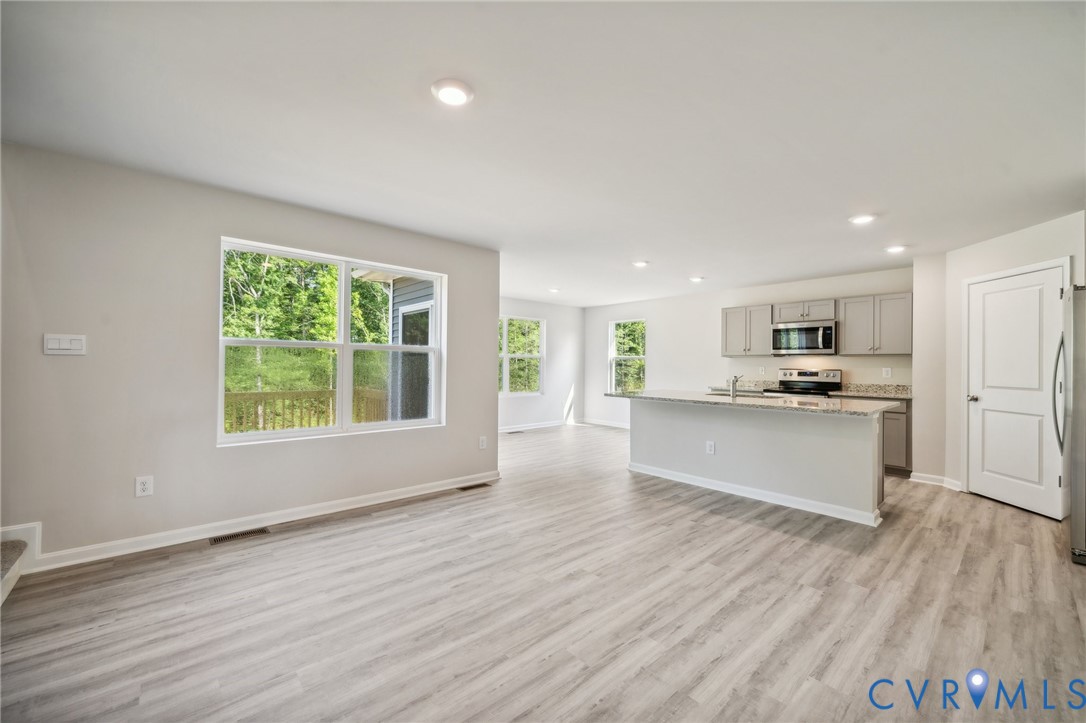 1740 River Vista Road Hopewell, VA 23860 - Photo 2 of 24 a view of kitchen with wooden floor and window