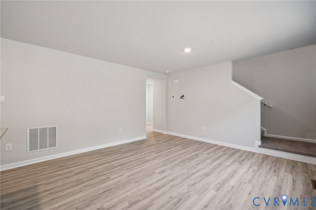 1740 River Vista Road Hopewell, VA 23860 - Photo 4 of 24 a view of an empty room with wooden floor