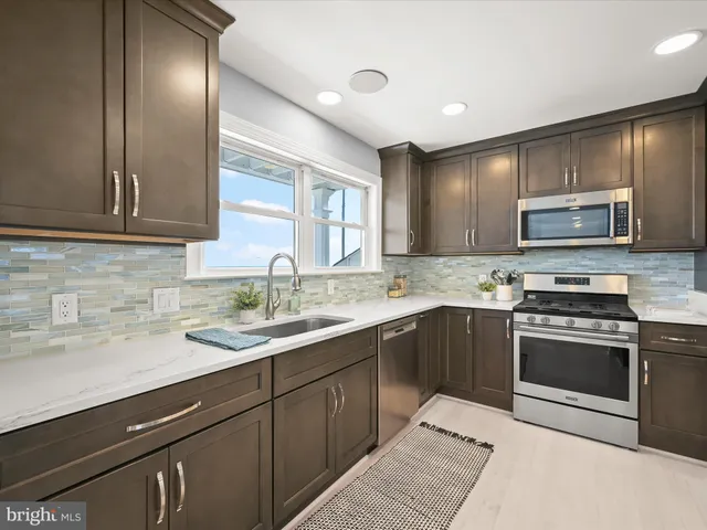 a bathroom with a shower and a glass door