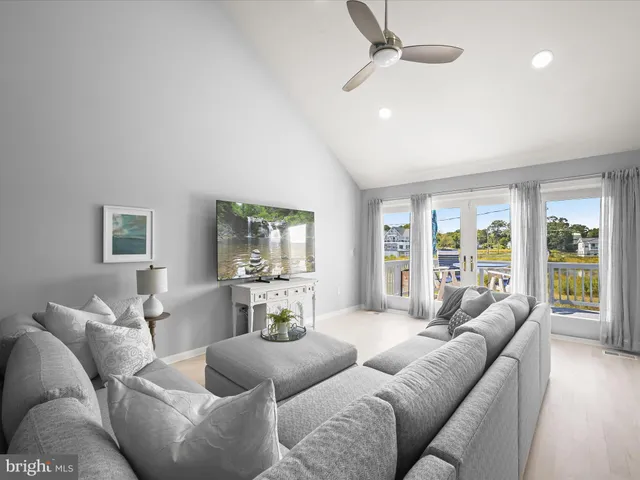 a bathroom with a granite countertop sink a mirror and a shower
