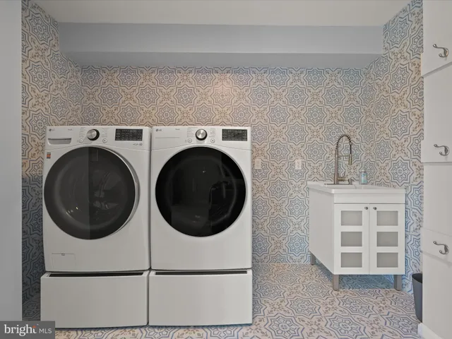 a bedroom with a bed a dresser and a window