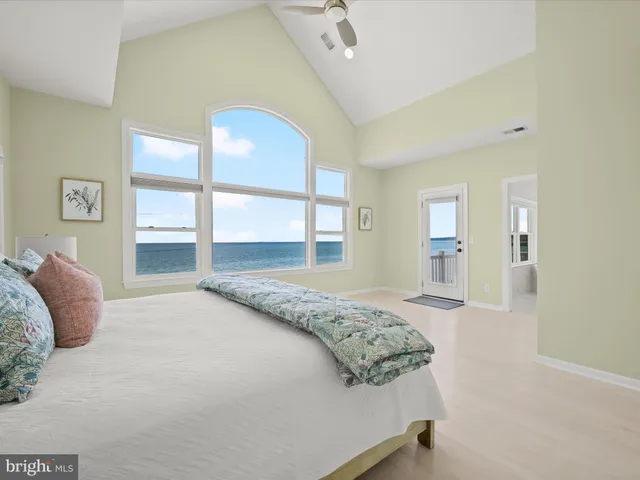 a bedroom with a large bed and a window