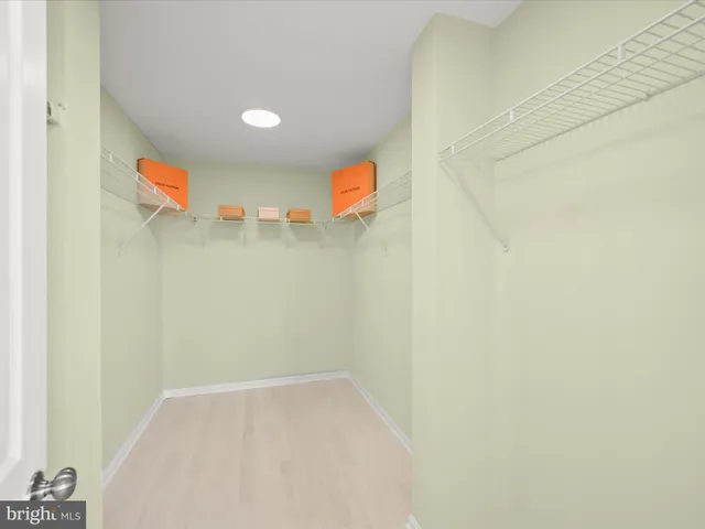 a bedroom with double bed and a night stand