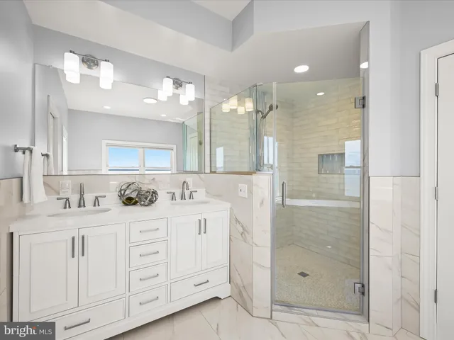 a bathroom with a shower toilet and a sink