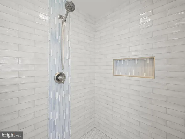 a spacious bedroom with a large bed and a window