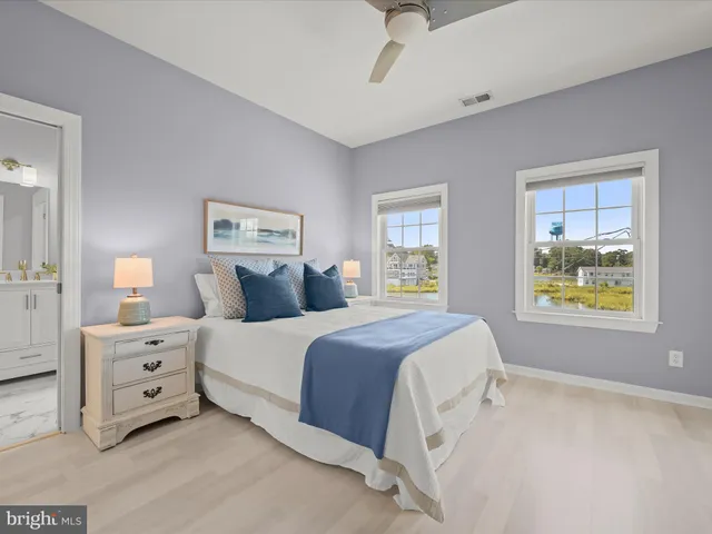 a spacious bedroom with a bed and window