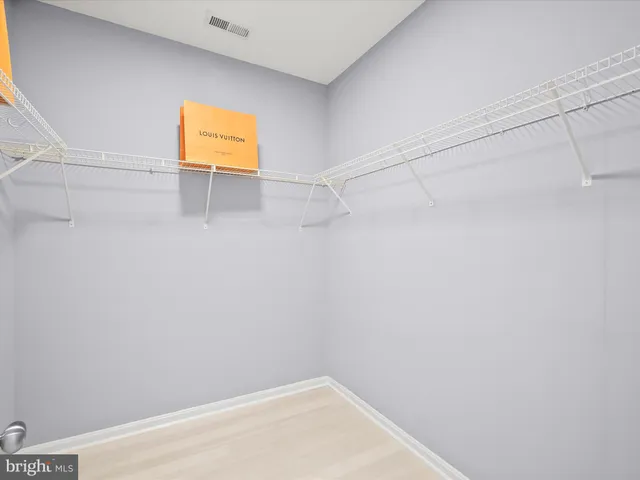 a view of a balcony with table and chairs and wooden floor