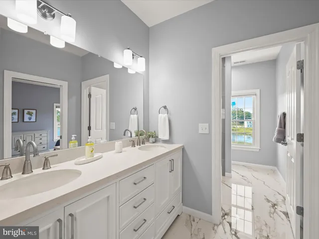 a view of a patio with table and chairs and potted plants