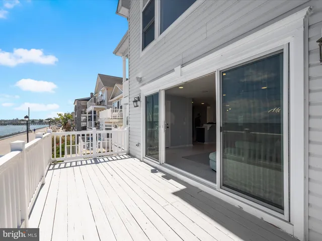 a living room with furniture and a wall painting