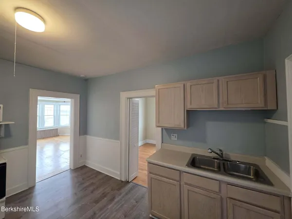 a kitchen with a sink and cabinets