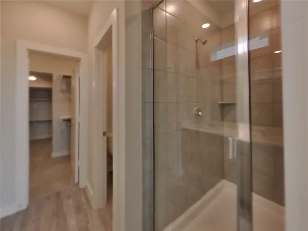 a bathroom with a bathtub and shower