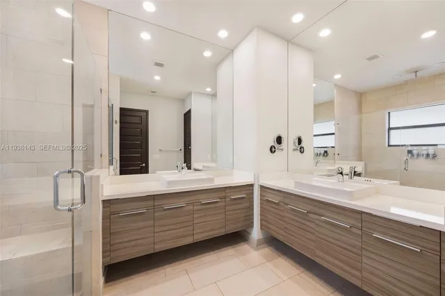 a bathroom with a double vanity sink mirror and double