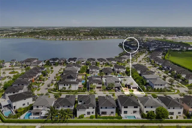 an aerial view of residential houses with outdoor space