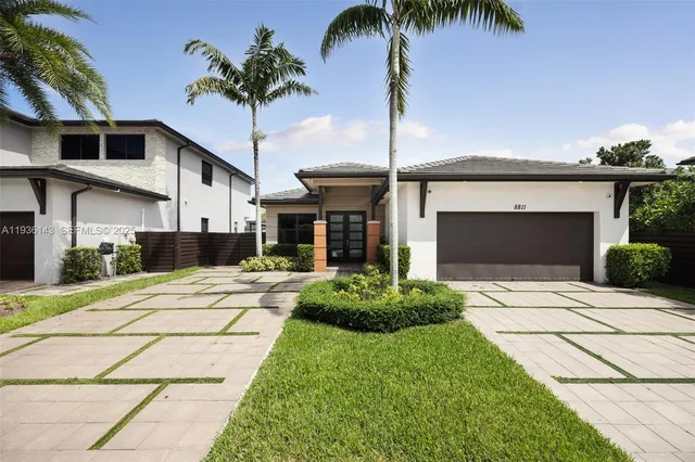 a front view of a house with garden
