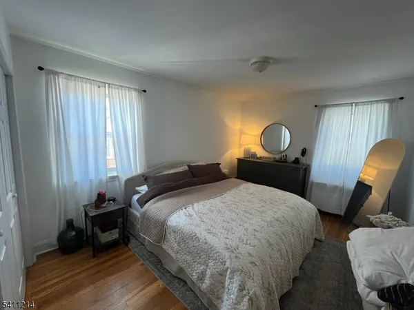 a bedroom with bed and window
