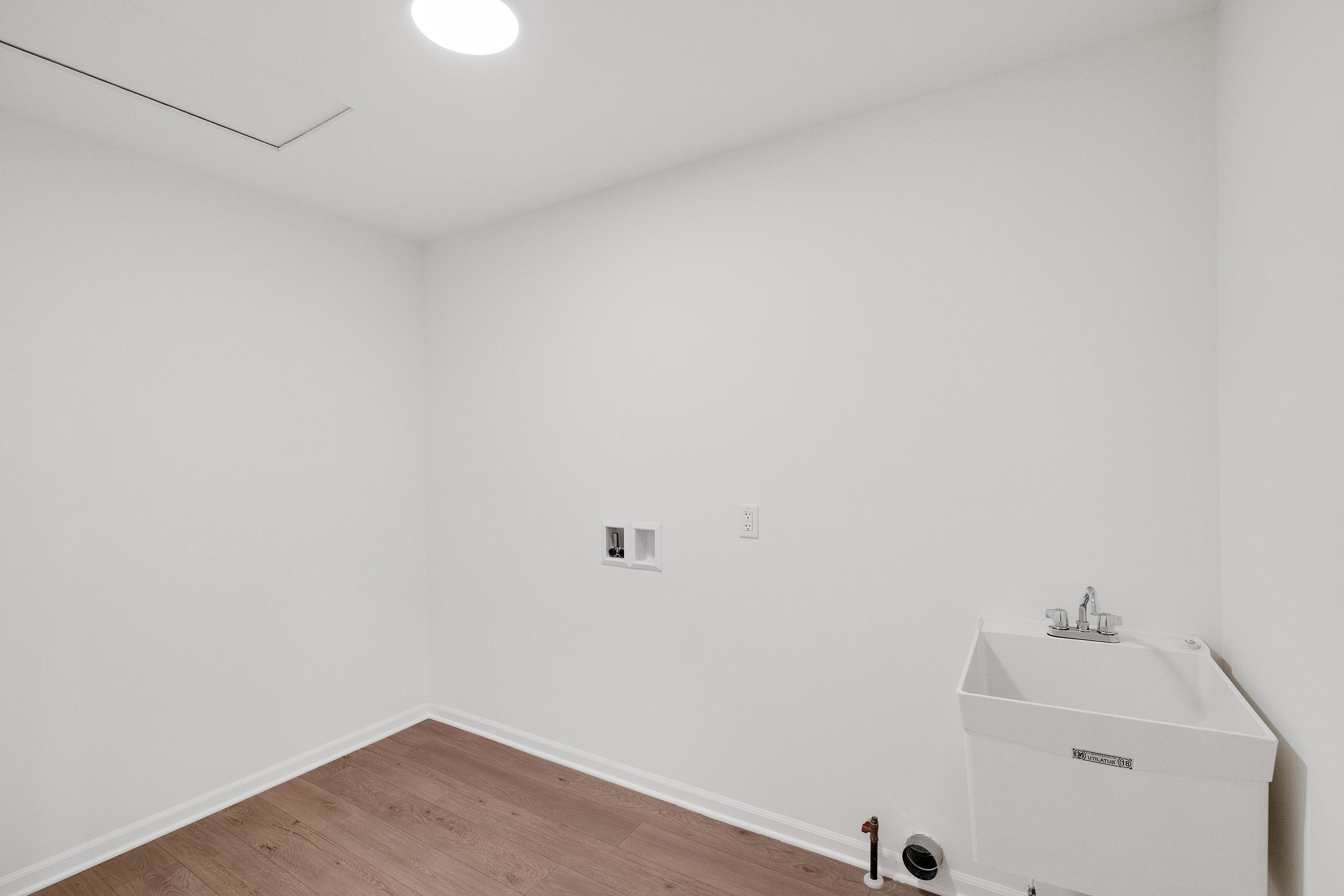 13080 Carolina Street Crown Point, IN 46307 - Photo 19 of 23 a bathroom with a sink and vanity